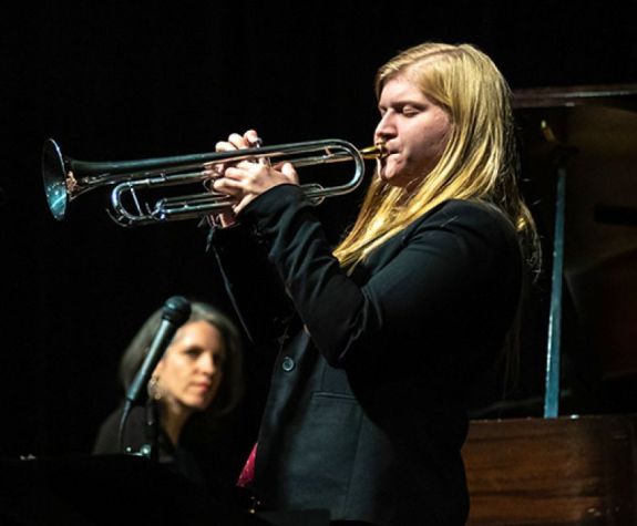 Kate Williams playing her trumpet 